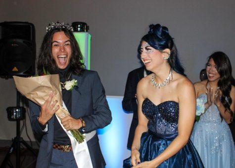 Drew Collier, senior, cheers for Izabel DeLeon, senior, when she was announced as the 2022 prom queen.