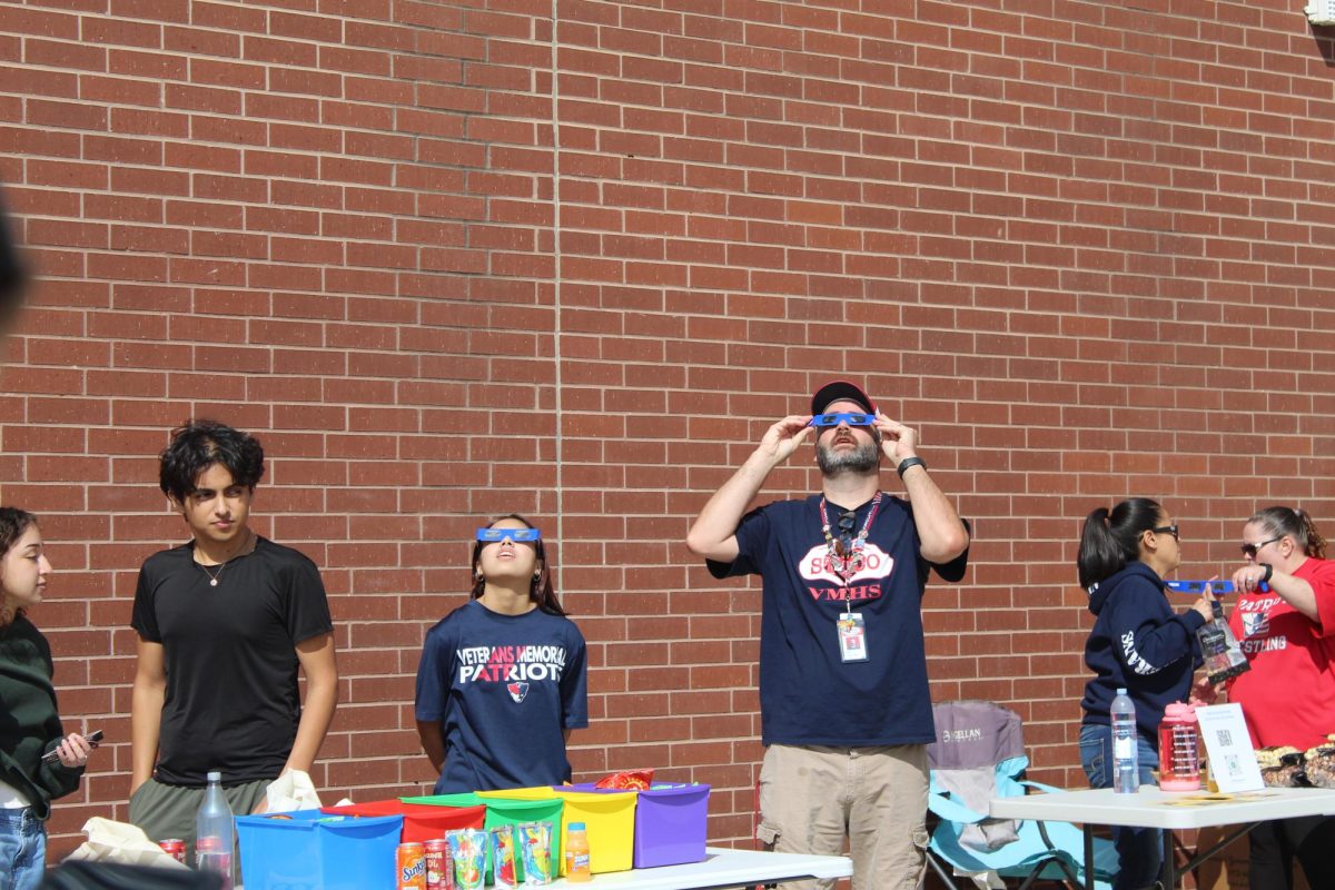 The patriot fans came and  viewed the solar eclipse . The science department was hosting a solar eclipse party from 10-2  in the student parking lot  Oct 14   