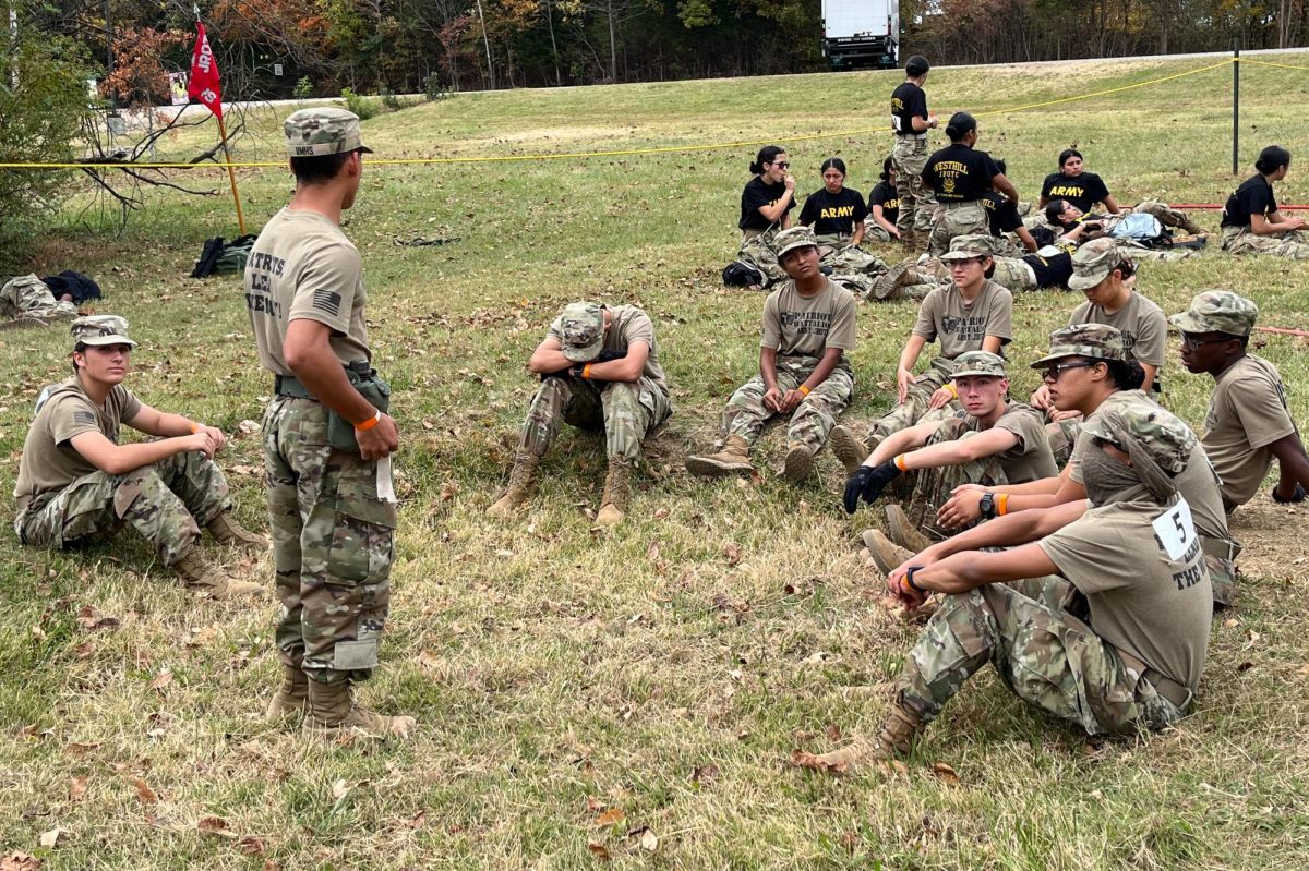 Senior Lukas Carter (Standing) briefing his team about safety on the cross country rescue course on competition day Oct. 25.