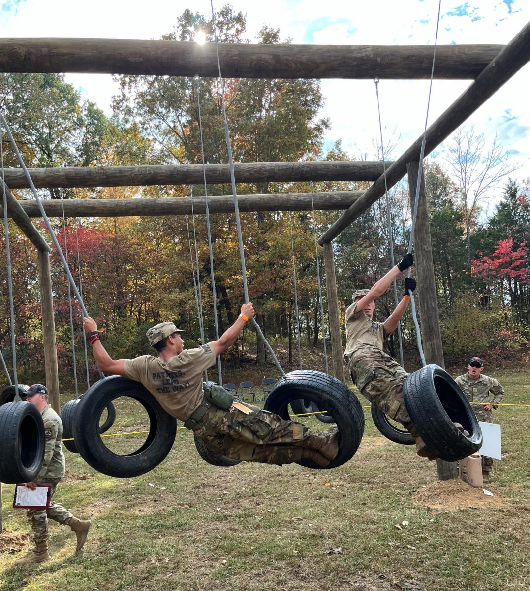 Senior Lukas Carter (Left) and Senior Liam Evans (Right) tackling the tire swing obstacle in the cross-country rescue.