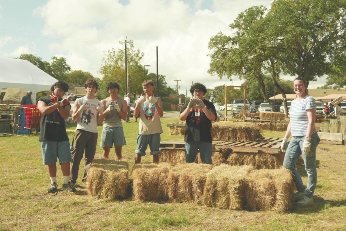 (From left to right) Junior Nicholas Gaytan, Seniors Ian Ortiz and Austin Espiritu, Sophomore Aidan Carter, Senior Samuel Herrera, and Theater Director Rachel Gilmour are ready to move the freshly delivered bundles of hay. The technician crew started the morning strong with tough gloves and sleeves rolled, lugging hay bales across the park. 