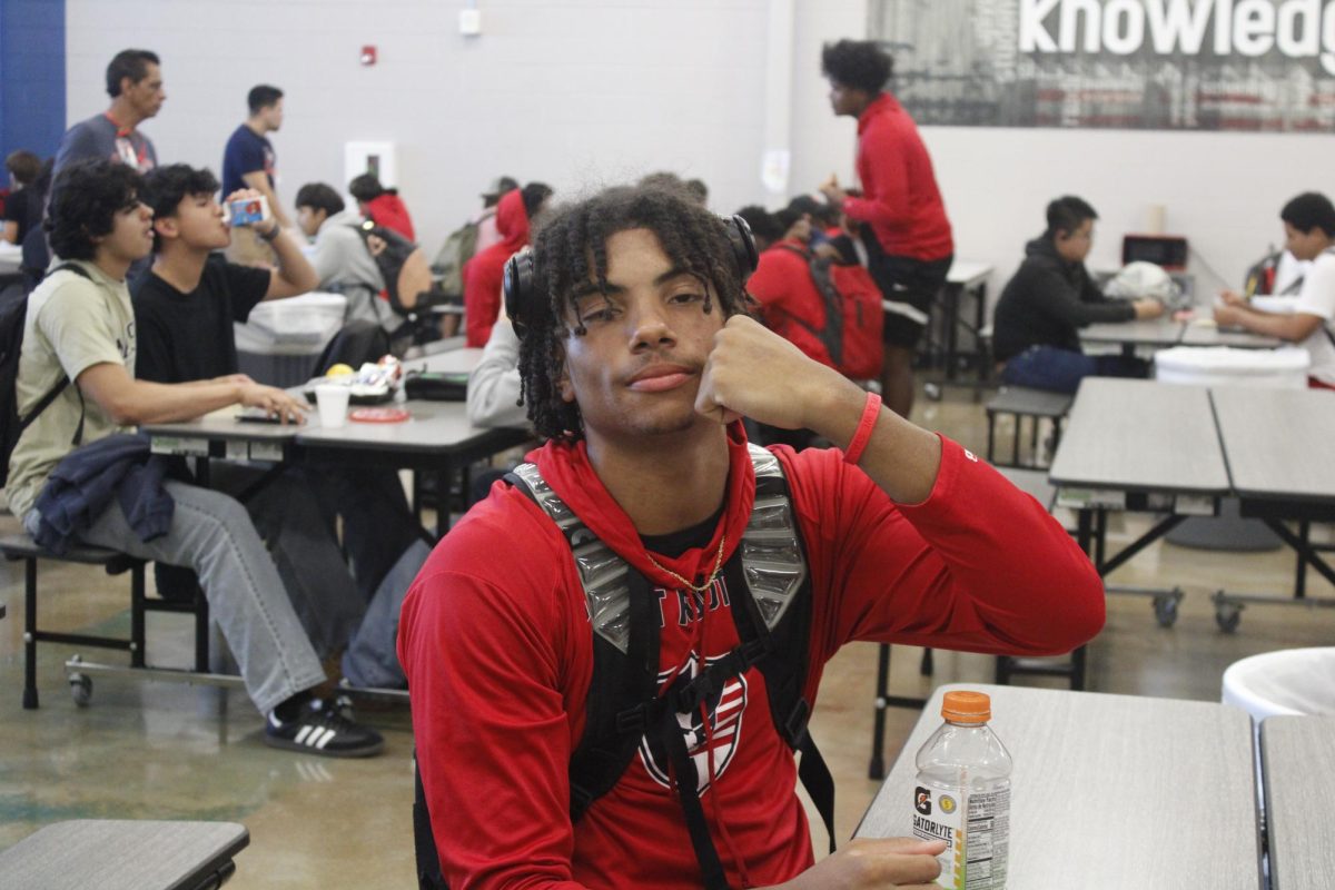 Varsity athlete, Anthony Keith, junior, holds up a bracelet earned after pledging to stay drug and alcohol free during Red Ribbon Week.