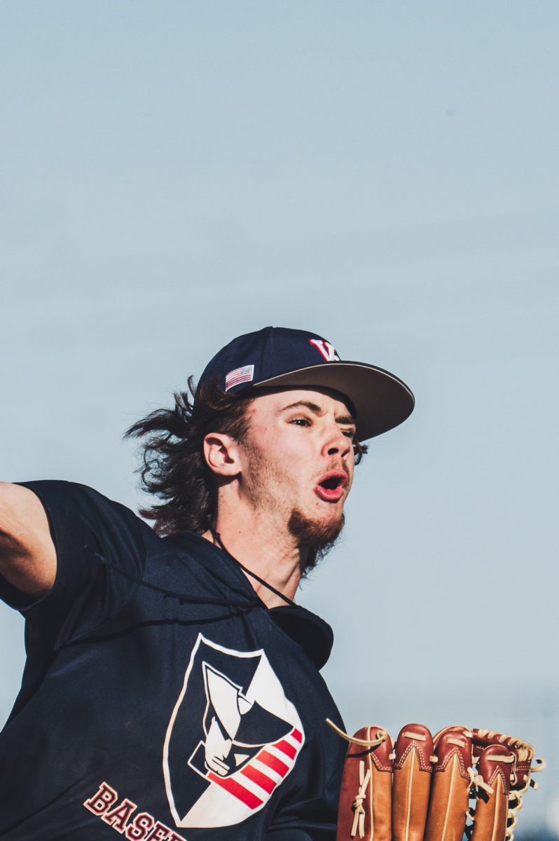 Pierson Lehman, Senior, pitches a fast ball against Wagner High School, on Saturday, February 1.